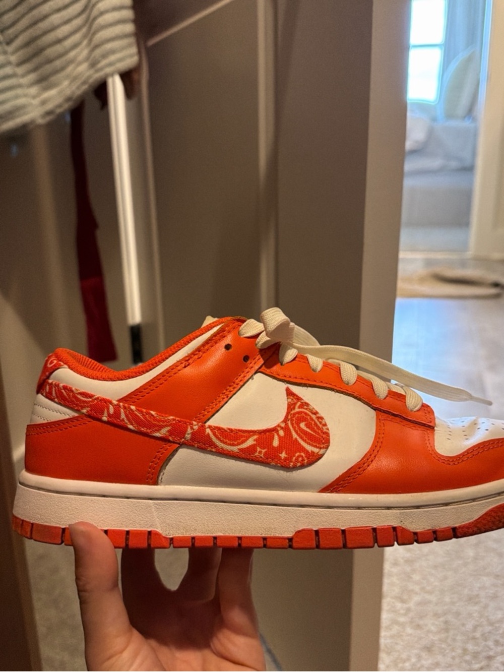 Nike Orange and White Low-Top Sneakers with Patterned Swoosh